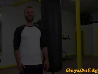 Bound gay cocksucked in gym threesome